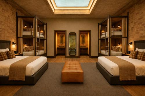 a bedroom with two beds and a skylight at Voltage Lodge Collie in Collie