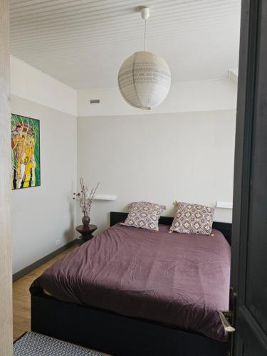 Llit o llits en una habitació de Comme à la maison