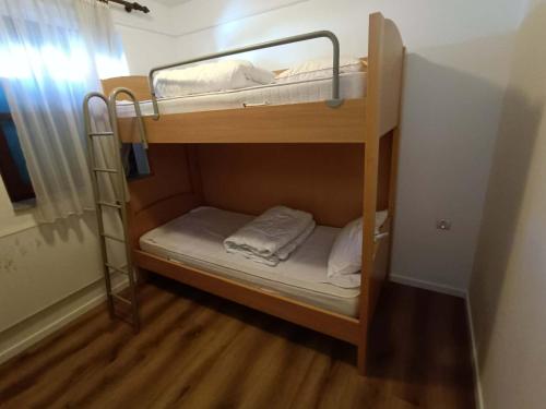 a couple of bunk beds in a room at Terme Čatež - Family apartments with pool tickets in Čatež ob Savi