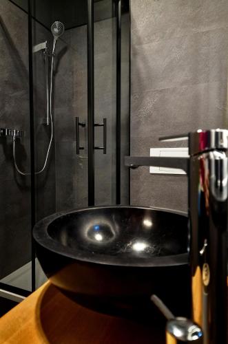 a sink in a bathroom with a shower at Pension Villa Grün in Zwickau
