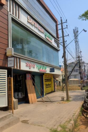 a store front of a building on a street at Mysore Couple Friendly at 999 in Mysore