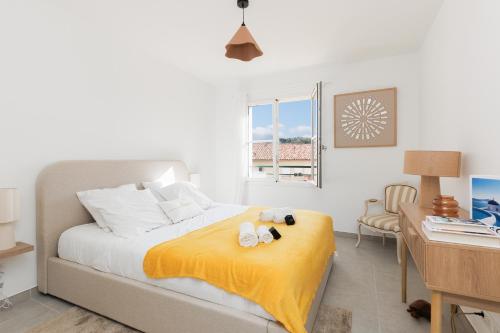 a bedroom with a bed with two stuffed animals on it at Féeries Provençales YourHostHelper in Grimaud