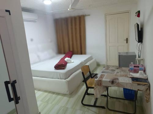 Llit o llits en una habitació de Gloriaka Hotel