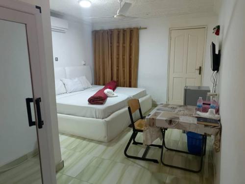 Llit o llits en una habitació de Gloriaka Hotel
