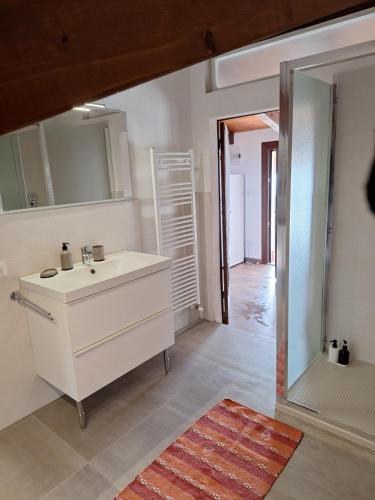 a bathroom with a sink and a mirror at AL30 Studios in Viverone