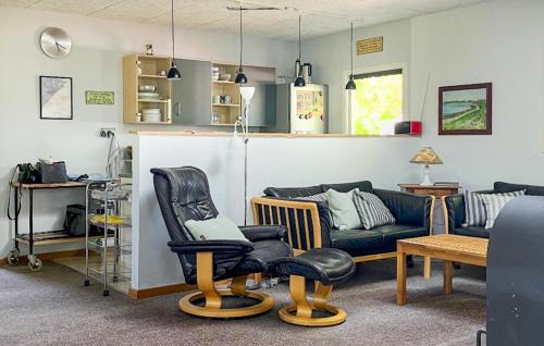 a living room with a couch and chairs at Holiday Home Ildervej Yellow in Hemmet