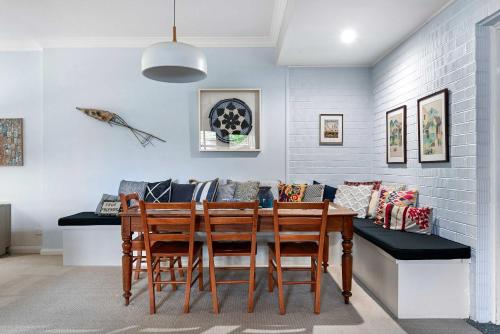 a dining room with a table and chairs at Coorabin in Orange