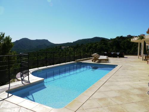 a swimming pool with a view of the mountains at Opulent Villa in Les Adrets de l Est rel in LʼÉglise