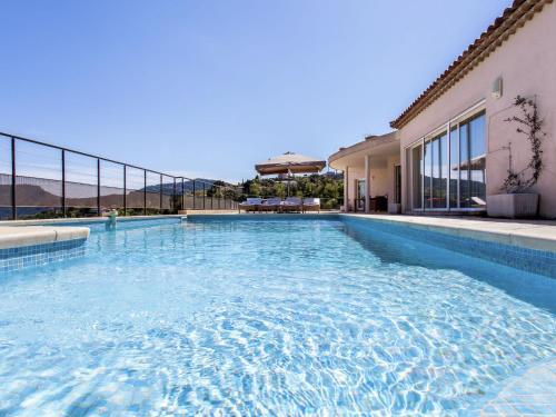 a swimming pool in the middle of a building at Opulent Villa in Les Adrets de l Est rel in LʼÉglise