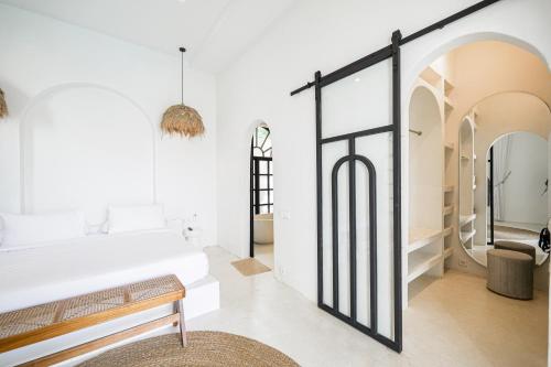 a room with a bed and a mirror at 5BR Ocen View Villa in Jimbaran in Jimbaran