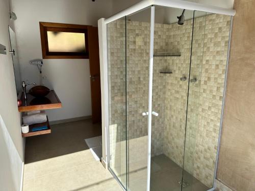a glass shower in a bathroom with a staircase at Doce Refugio in Santo Antônio do Pinhal
