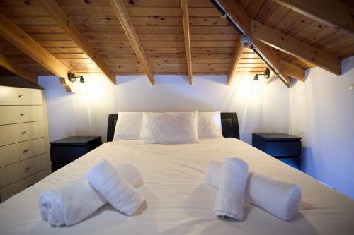 Katil atau katil-katil dalam bilik di Cozy Windmill View Apartment