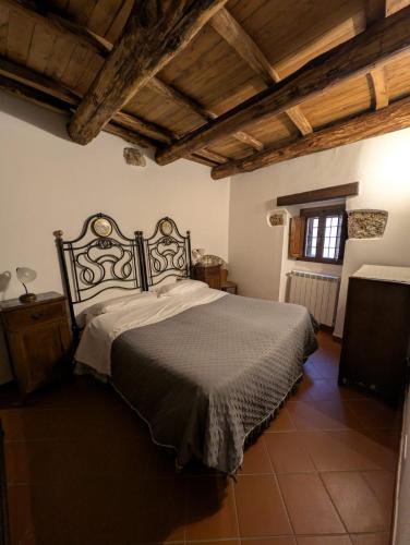a bedroom with a large bed in a room at Residenza La Torre in Santo Stefano di Sessanio