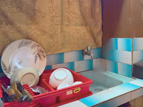 a toy kitchen with a toy sink with a red tray at Newa Home Bhaktapur in Bhaktapur