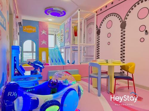 a childs play room with a table and play equipment at Bali Residence Melaka By Heystay Management in Malacca