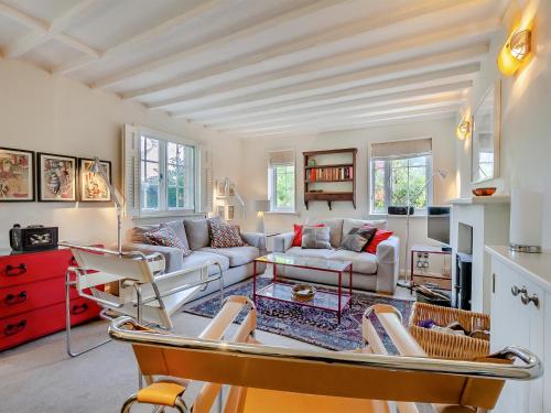 a living room with a couch and chairs at Pensway in Burpham