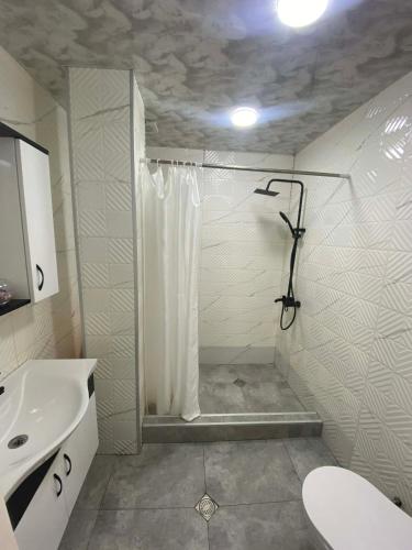 a bathroom with a shower and a sink at Welcome2 in Kobuleti