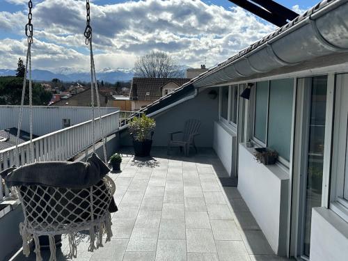 a balcony with a hammock on a house at Private studio in Loft in Tarbes in Tarbes