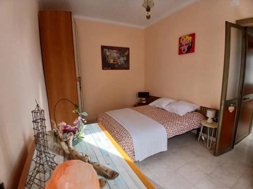 a small bedroom with a bed in a room at Casa La V G in Almese