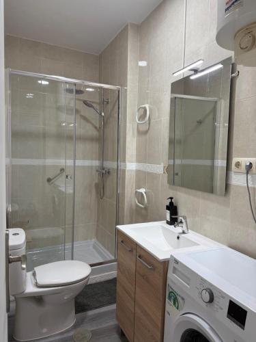 a bathroom with a shower toilet and a sink at LUZ DEL MAR Almuñécar Centro Playa in Almuñécar
