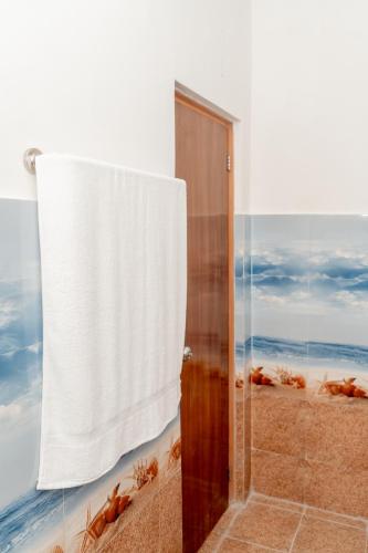 a bathroom with a shower with a shower curtain at Kandy Golden Gate Resort in Kandy