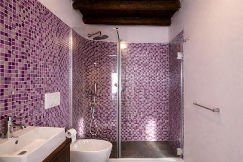 a bathroom with a shower and a sink at Spinuzza Boutique Guesthouse Cefalù, Sicily in Cefalù