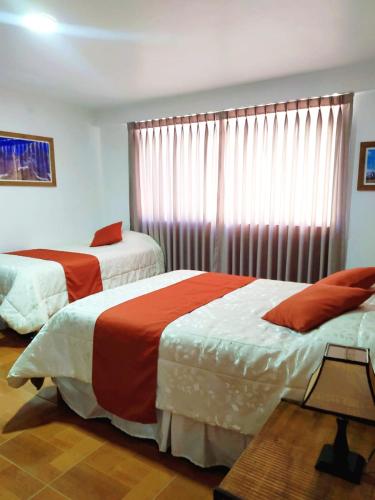 CASA TALIOS tesisinde bir odada yatak veya yataklar