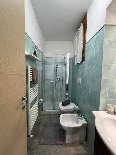 a bathroom with a shower and a toilet and a sink at Casa del Duca Portoferraio in Portoferraio