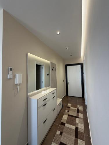 a bathroom with a sink and a toilet at Rapo Apartment in Krujë