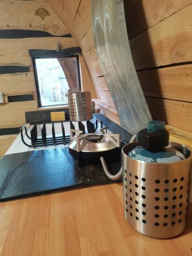 a kitchen in a tiny house with a sink at La Verdine in Lacaze