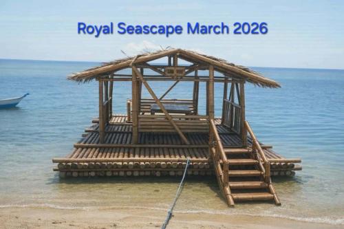 a wooden structure in the water on a beach at Beachfront Prime Villa 2 with Private Pool in Calubcub Segundo
