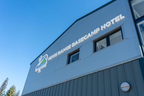 a sign on the side of a building at The Base Camp Hotel, Nevis Range in Fort William