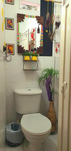 a bathroom with a white toilet in a room at Antigua Hostal in Bucaramanga