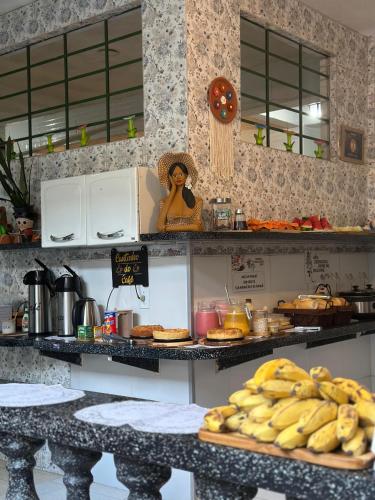 a kitchen with a bunch of bananas on a counter at Pousada Preocupacao Zero in Ubajara