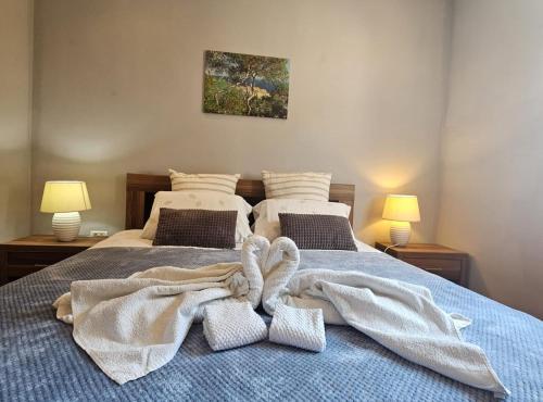a bedroom with two beds with towels on them at Villa Tena Rovinj Istria in Rovinj