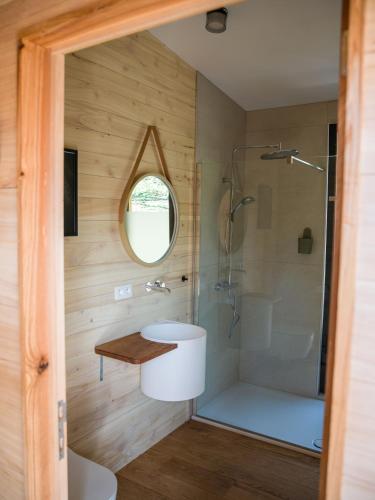 a bathroom with a shower and a sink at Chez Oreste - Escapade à 2 avec sauna et jardin clos in Aywaille
