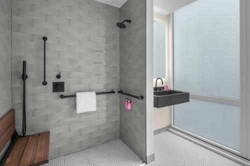 a bathroom with a sink and a shower at Moxy NYC Downtown in New York