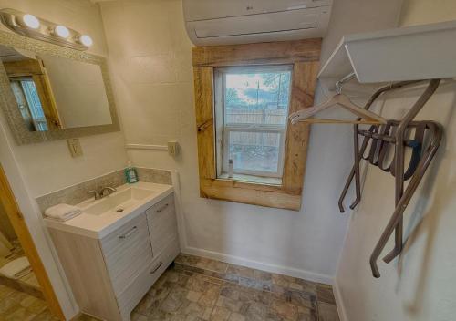 a bathroom with a sink and a window at Pinion 6 Mokee in Bluff Kitchen, Sleeps 4 in Bluff