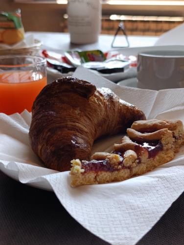 a plate of food with a pastry on a table at Hotel Monte Viglio in Filettino