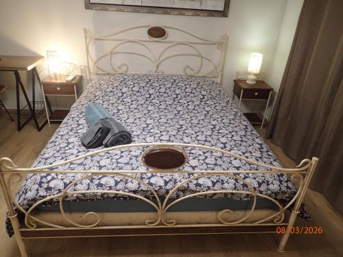 a bed with a backpack on top of it at Chambre Privée avec Sauna in Villeneuve-Loubet