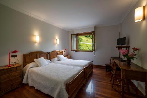 Llit o llits en una habitació de Agroturismo Ibarre