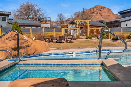 a swimming pool with a slide in a resort at Timber & Tin H 2Bed 2Bath w Pool & Rooftop Deck in Kanab