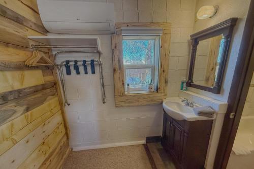 a bathroom with a sink and a window at Birds - King Suite Pets ok, Shared Kitchen #3 in Bluff