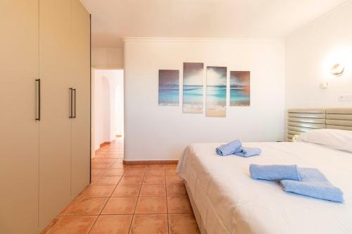 a bedroom with a bed with two towels on it at The Denia Hideaway in Denia