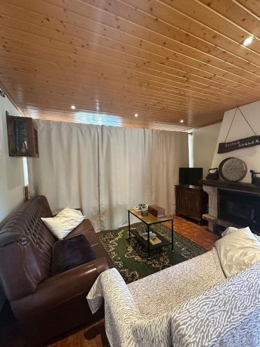 a living room with a couch and a table at Casa do Vale - Seixas in Caminha