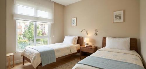 a bedroom with two beds and a window at Levent Hotel in Lara
