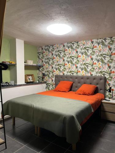 En eller flere senger på et rom på Gîte Olivia