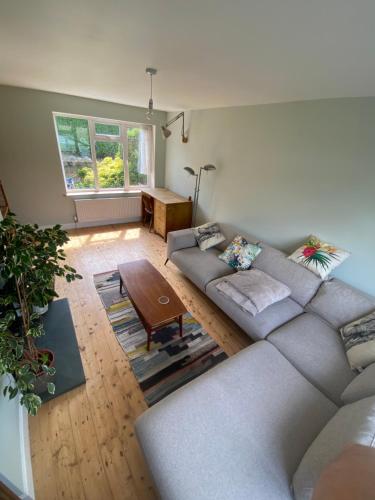 a living room with a couch and a table at Peaceful Fields in Lancaster