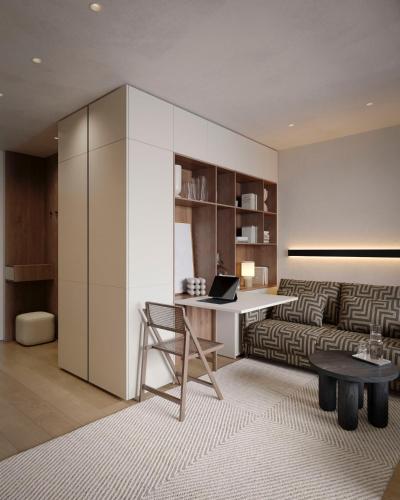 a living room with a desk and a couch at Apart-hotel Centr in Sumy