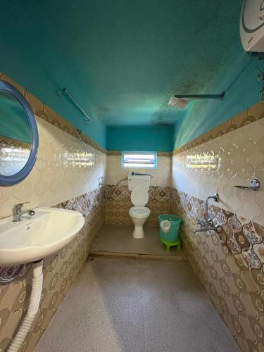 a bathroom with a sink and a toilet at SOUPRIYA Impression Homestay in Pedong